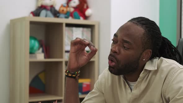 African American Teacher During a Lesson at School