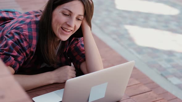 Girl Working with Laptop Outdoors