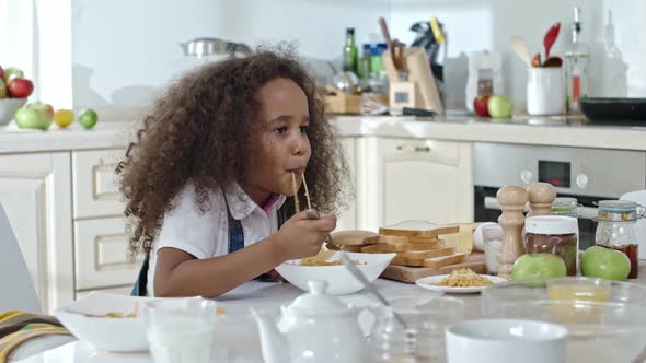 Little Girl Having Spaghetti for Dinner alt