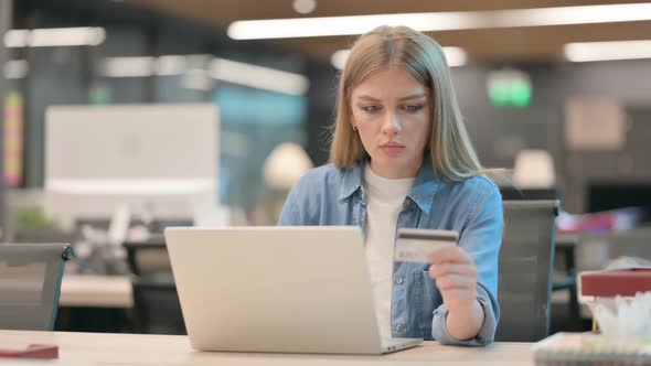 Young Woman Making Successful Online Payment on Laptop