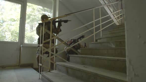 Counterterrorism Special Forces Team Walking Up Stairs Indoor