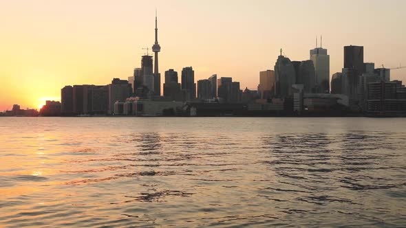 Toronto skyline view at sunset across Lake Ontario