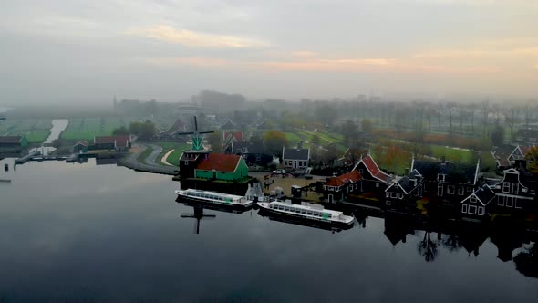 Wooden Wind Mill at the Zaanse Schans Windmill Village During Winter with Sfogy Landscape Wooden