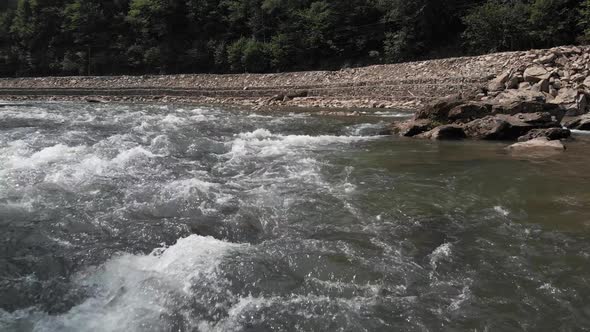 Close Up of Rapid River Stream Near the Road