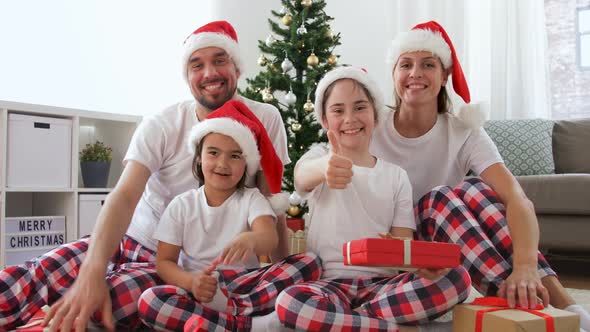 Family with Christmas Gifts Has Video Call at Home