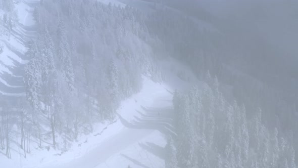 Aerial View Skier Riding on Ski From Mountain Slope in Winter Resort