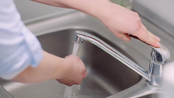 Washing and Disinfecting Hands in Sink