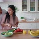 Overjoyed Mixed Race African American Man and Asian Woman Enjoying Cooking Healthy Tasty Vegetarian - VideoHive Item for Sale