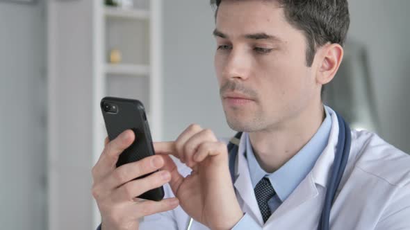 Doctor Using Smartphone for Internet