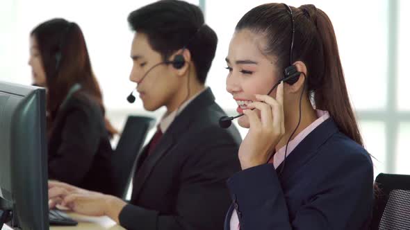 Business People Wearing Headset Working in Office