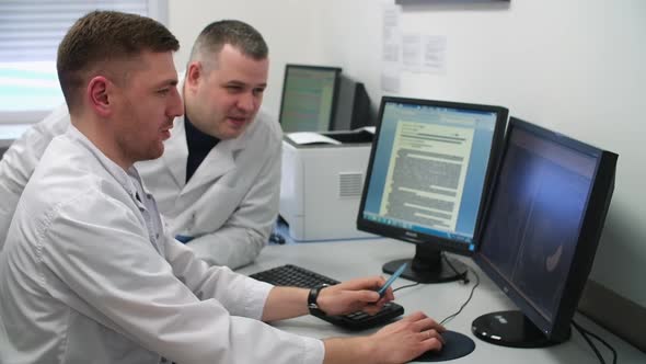Two Doctors are Discussing an MRI Picture of a Patient