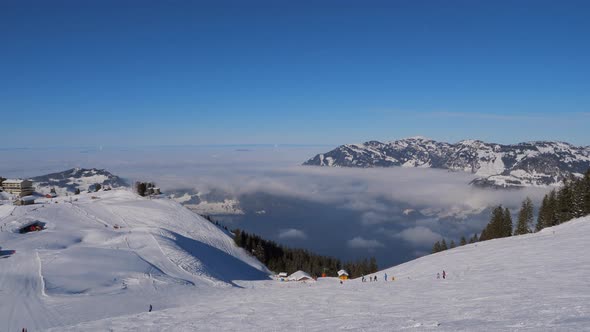 ski area in the Swiss alps with people and chairlifts in the winter ski area of ​​Beckenried