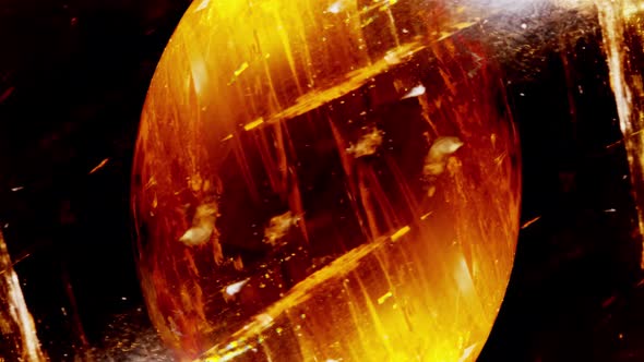 Amber. Beautiful Colored Pieces of Amber. Amber Texture. Red-yellow Amber with Bubbles, Waves