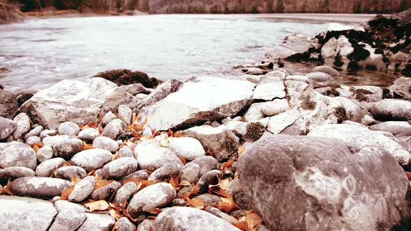 Dolly Slider Shot of the Splashing Water in a Mountain River Near Forest