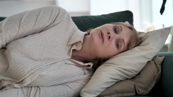 Tired Exhausted Mature Woman Falls On Sofa Cushions Falling Asleep