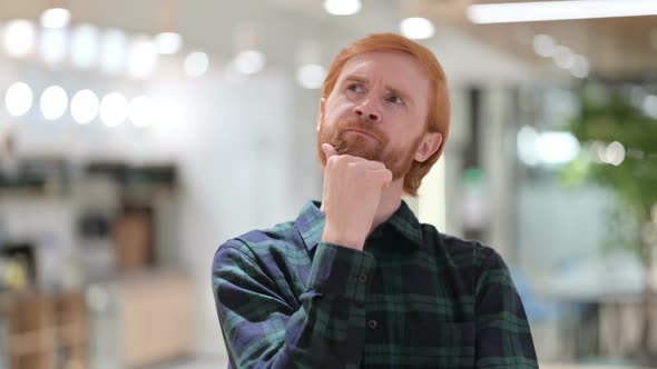 Portrait of Beard Redhead Man Thinking and Getting Idea