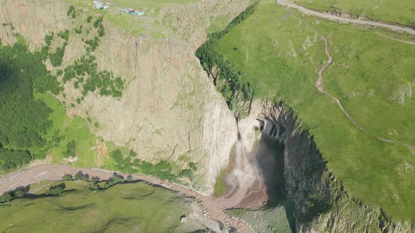 Dirty Waterfall Sultan High in the Mountains Near Elbrus in Summer