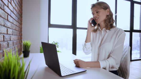 Businesswoman Talking By Mobile