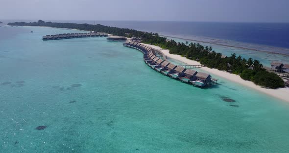 Wide angle fly over island view of a summer white paradise sand beach and turquoise sea background i