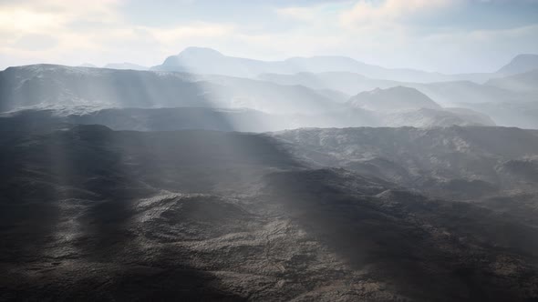 Aerial Vulcanic Desert Landscape with Rays of Light
