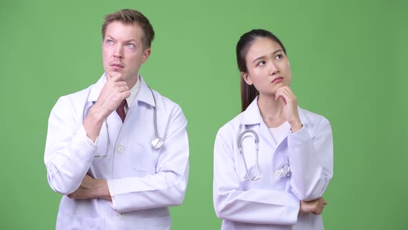 Multi-ethnic Couple Doctors Thinking Together