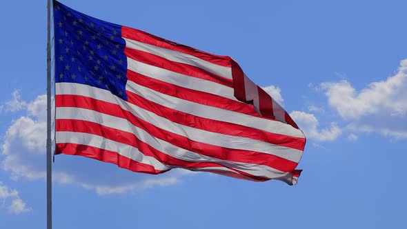 The flag of the United States of American blowing in the wind