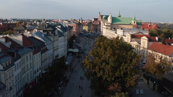 Forwards Fly Above Tourists Walking and Sightseeing on Krakowskie in Historic City Centre