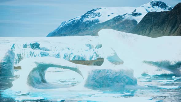 Antarctic Icebergs Near Rocky Beach