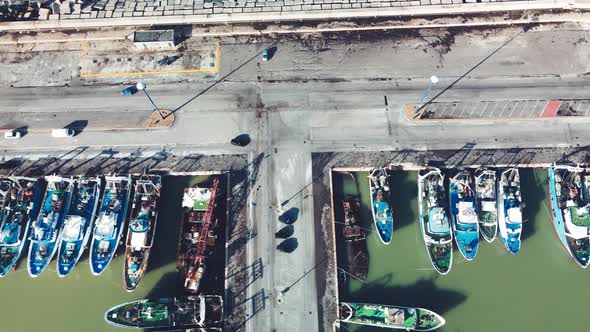 Fishing Boats in a Small Port Aerial Overhead View From Drone