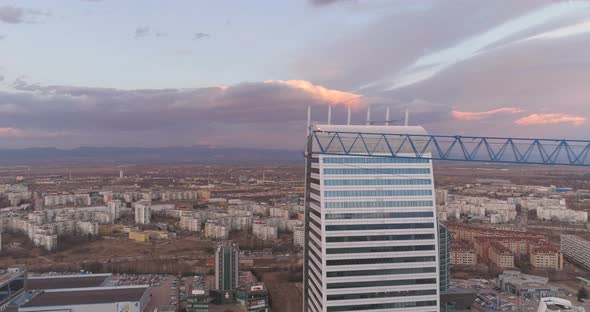 Tall Office Buildings and Tower Crane on Construction Site