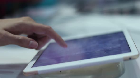 Young Woman Uses A Tablet In The Office