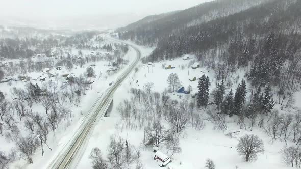 Drone View of Car Moving on Area Surrounded By Winter Landscapes