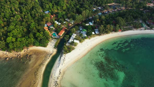 Beautiful landscape of Thailand's coast. River mouth sandy beach and luxury resorts. Aerial