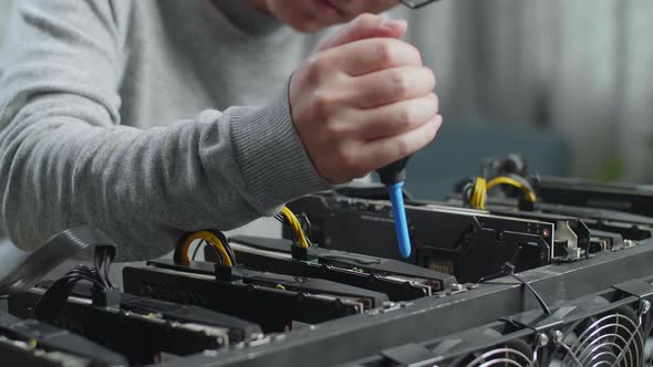 Close Up Of Man'S Hands Clean The Mining Rig For Mining Cryptocurrency