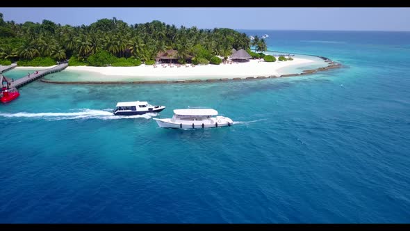 Aerial travel of luxury island beach lifestyle by shallow ocean and white sand background of a dayou