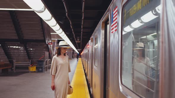 Young passenger entering a subway car