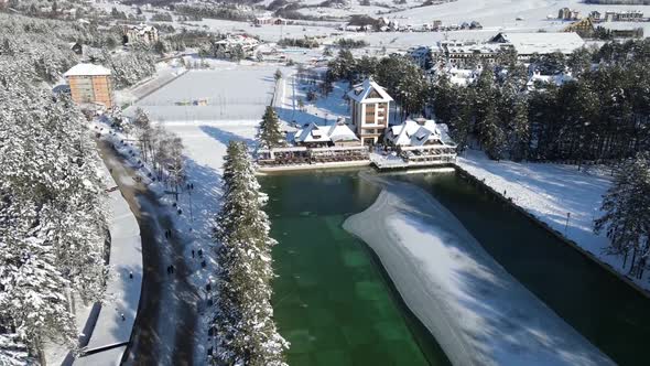 Zlatibors lake and hotels. Aerial shot of winter tourism center.