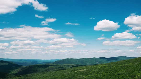 Landscape with Clouds Floating Across Sky Green Hills