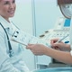 Friendly doctor finishing ultrasound inspection - VideoHive Item for Sale