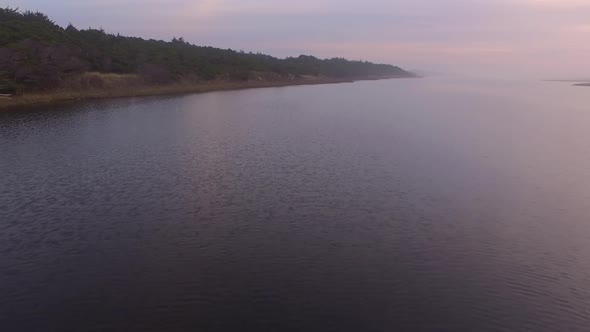 Aerial video of New River, Oregon. Running parallel to the Pacific Ocean for nine miles, this river