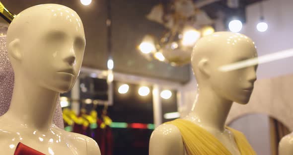 Boutique Display Window Of Mannequins Dressed In Women's Casual Clothing Shop In Shopping Mall.