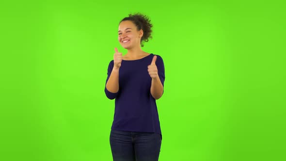 Curly Woman Showing Thumbs Up, Gesture Like. Green Screen