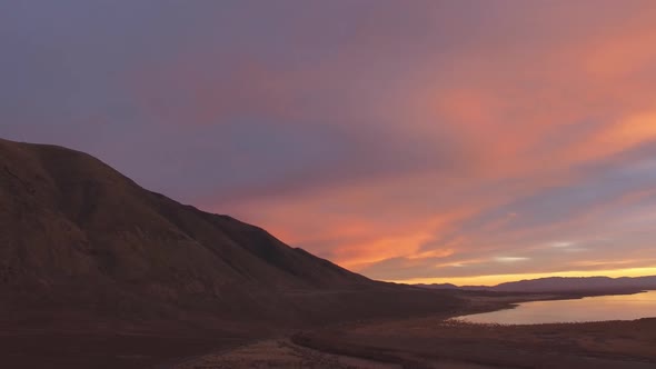 Aerial view of mountain side during colorful sunset