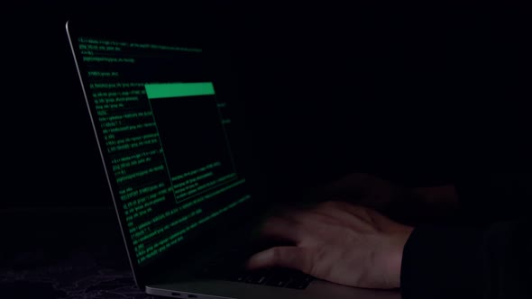 Hands Hacker Using Laptop Computer Hacking In The Dark Room