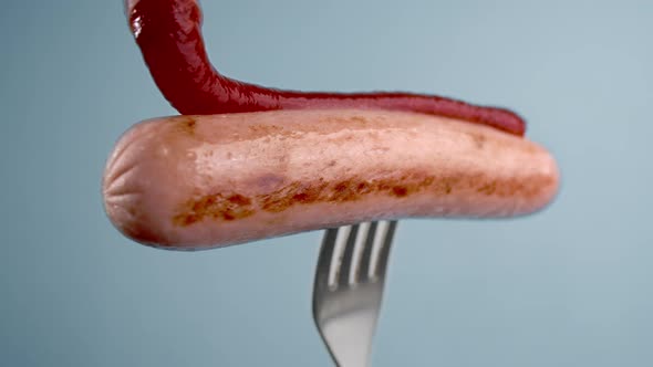 Tomato Hot Sauce Drops To the Sausage in Slow Motion, Tomato Ketchup with Meat, Sausage on Fork