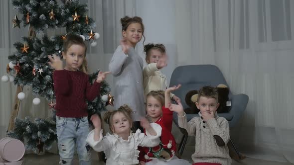 A group of children with New Year's gifts, happy friends for Christmas