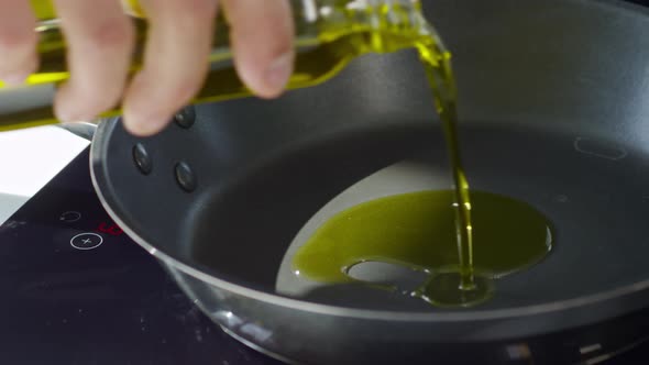 Pouring Olive Oil into Pan