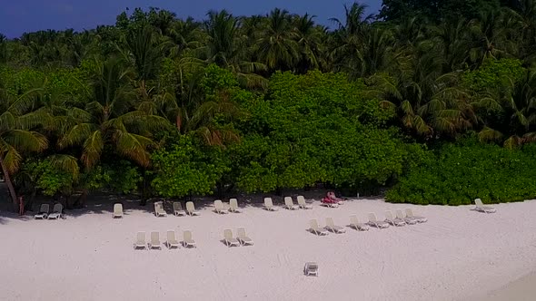 Aerial abstract of resort beach by clear ocean with sand background