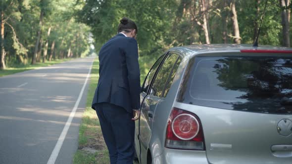 Back View Drunken Driver Walking to Car Sitting on Driver's Seat Closing Door