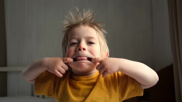 Boy Joking Sticking Tongue Out with Silly Expression